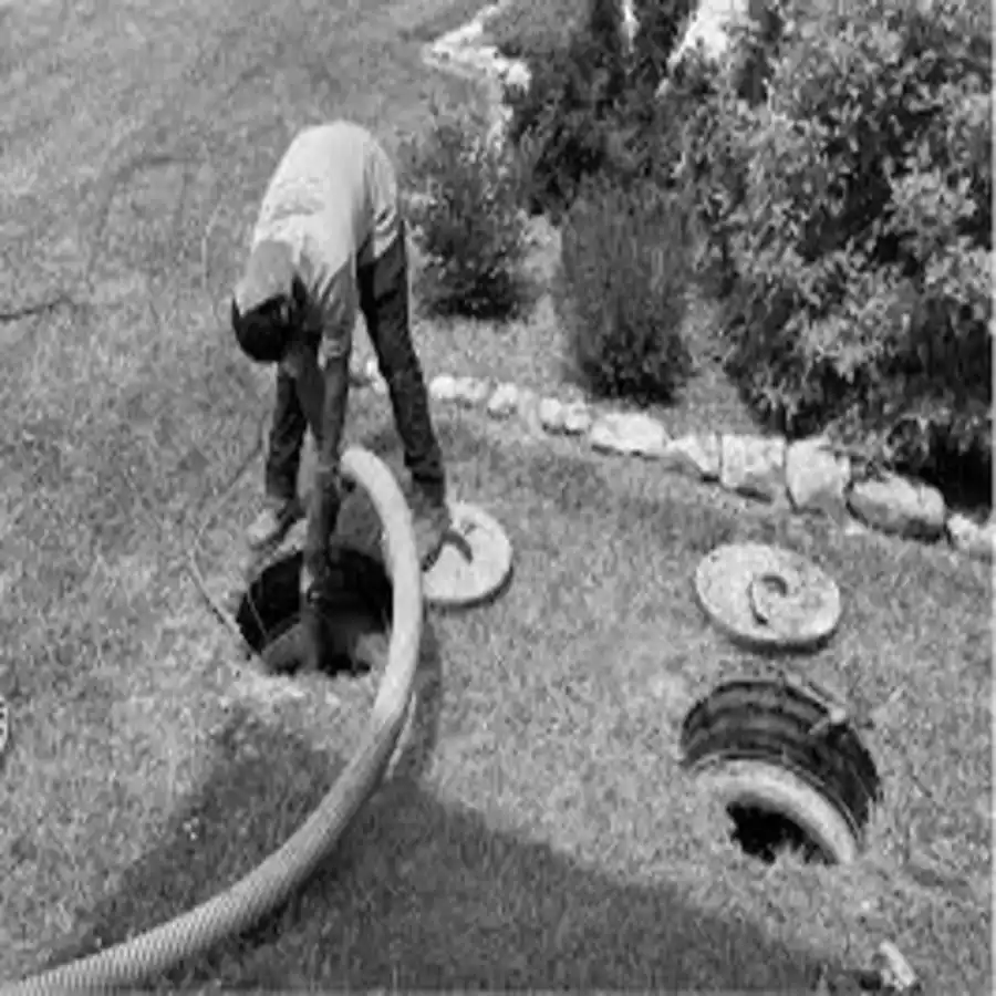 Aerobic treatment unit inspection - technician opening access lids for service
