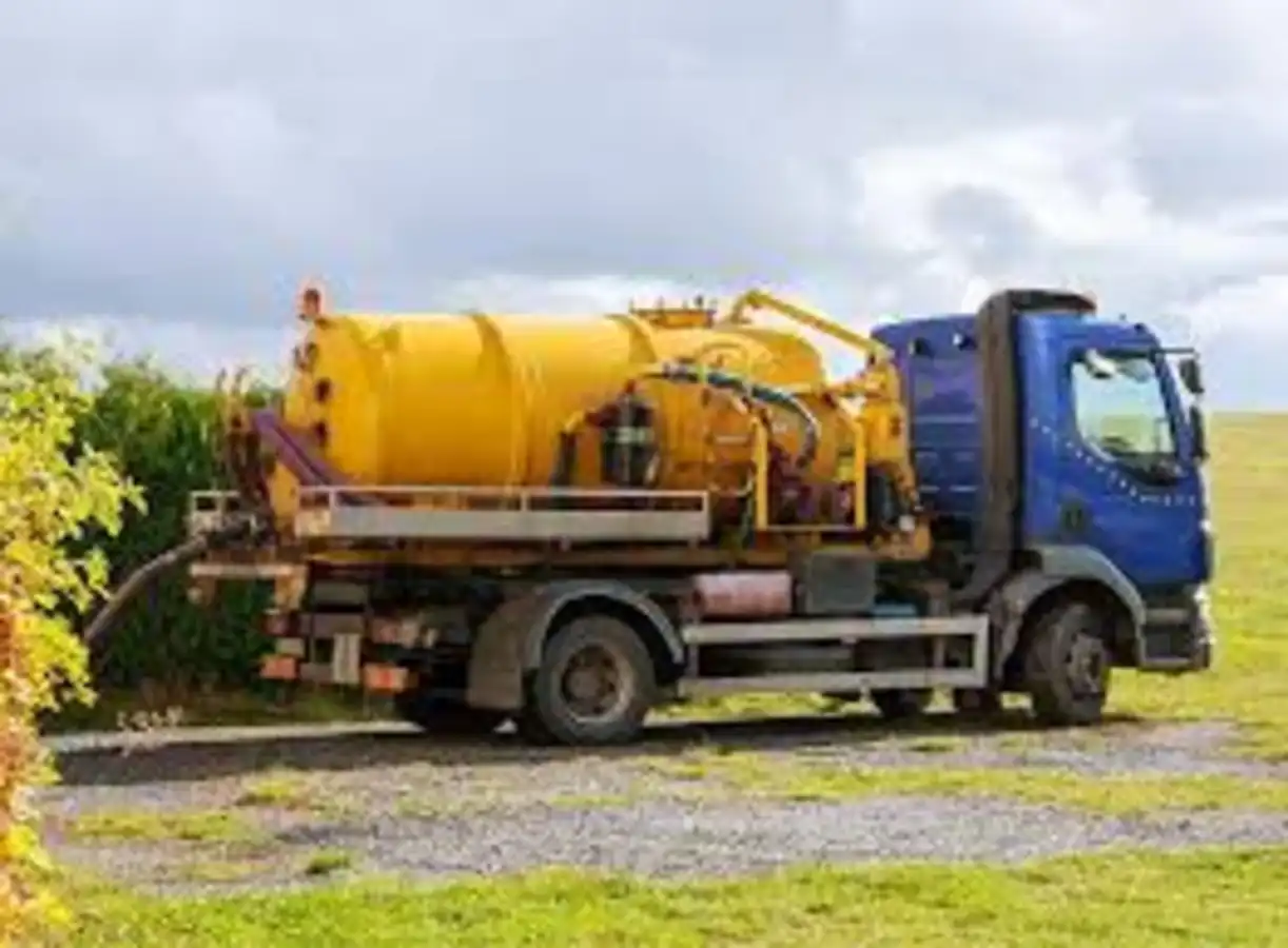Septic tank pumping near me — truck parked on site for service