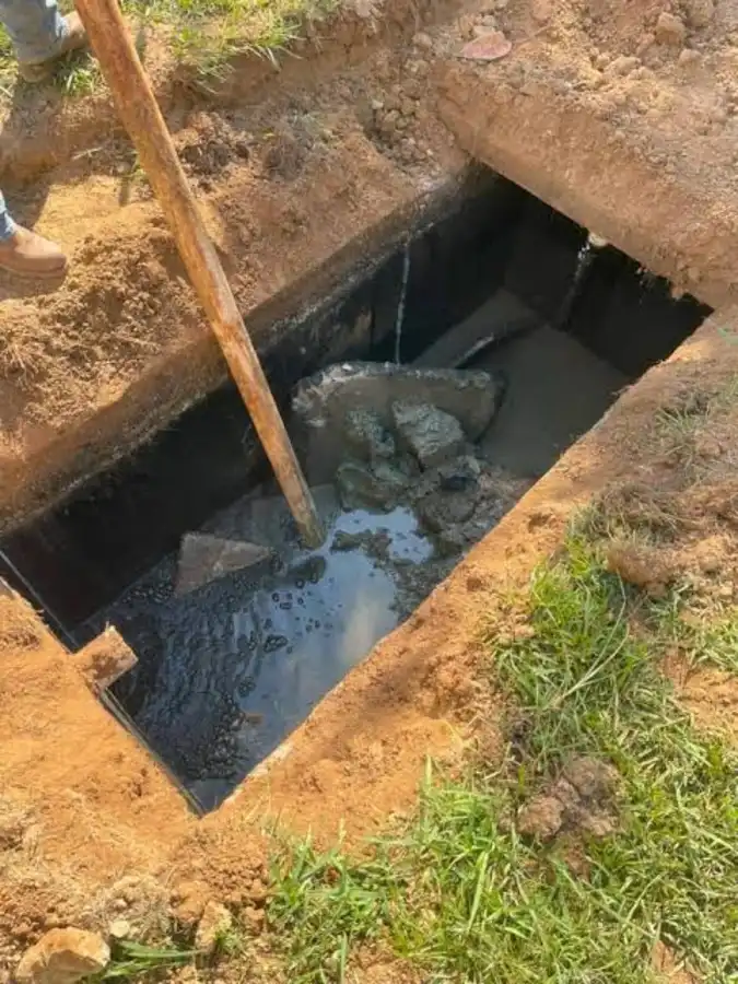 Septic tank additives - interior view of a tank showing waste buildup before pumping
