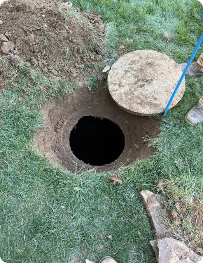 Septic tank lid pried open ahead of tank pumping