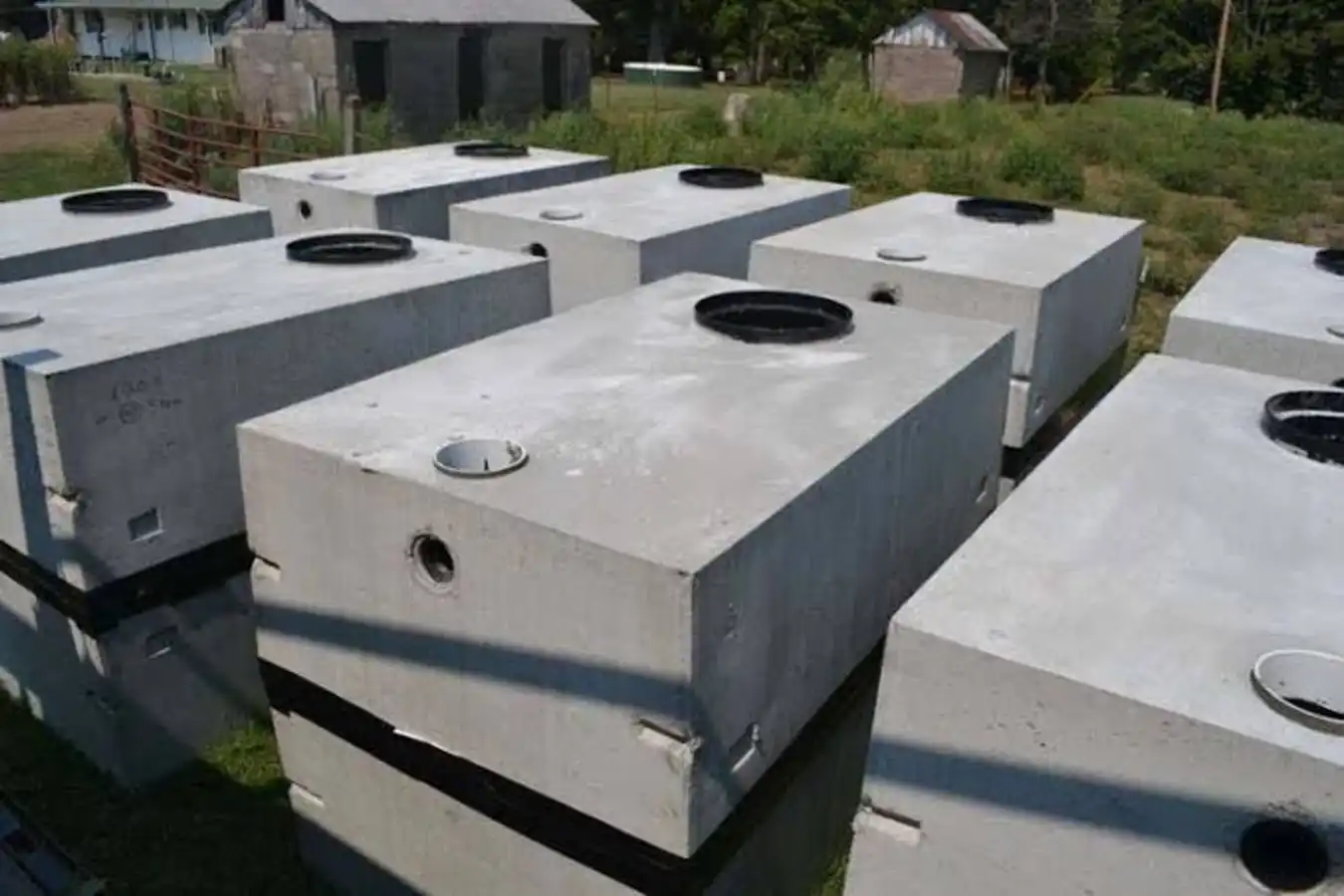 What size septic tank do I need - stacked concrete tanks ready for installation