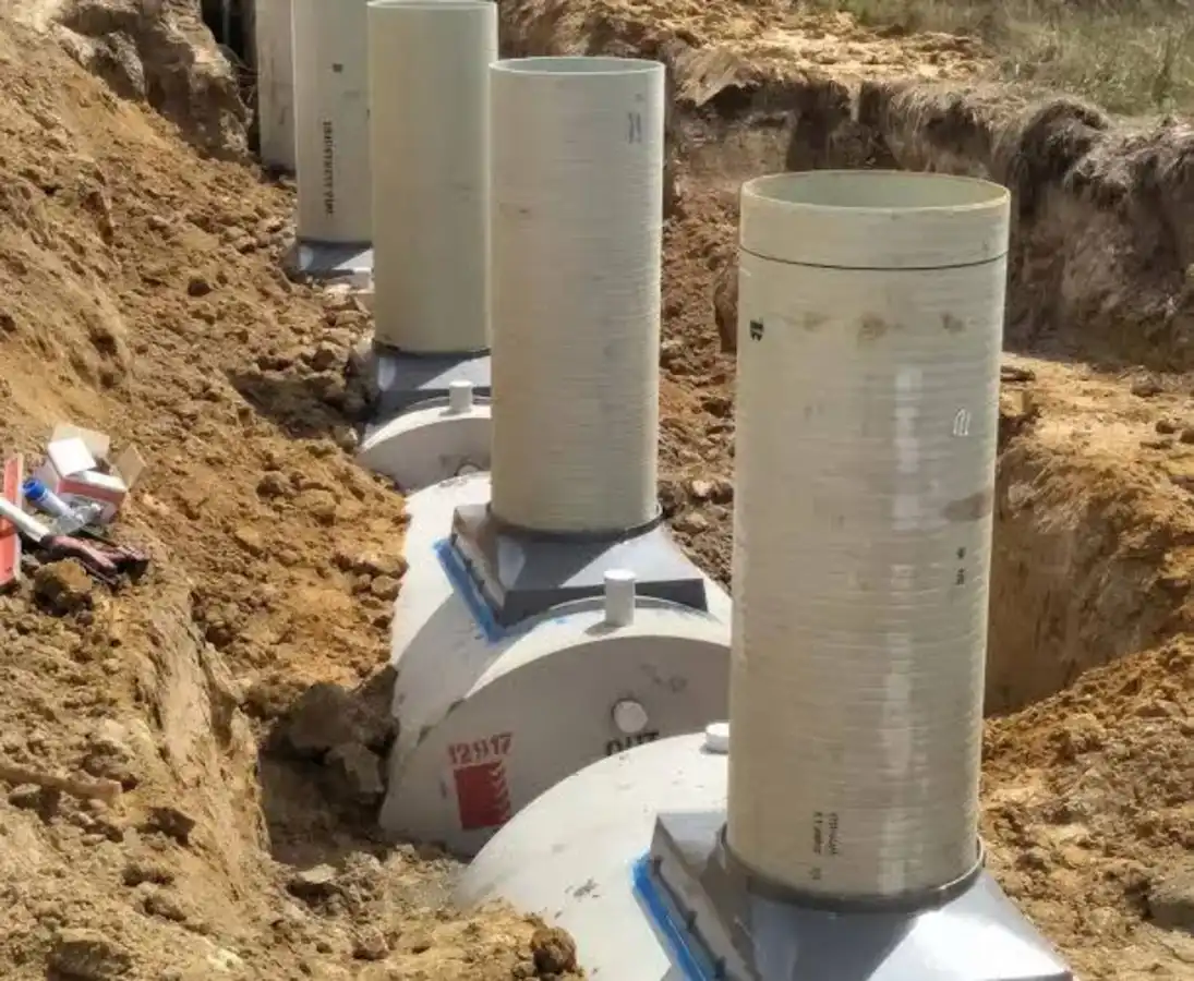 Fiberglass septic tanks in a trench for a Pennsylvania installation